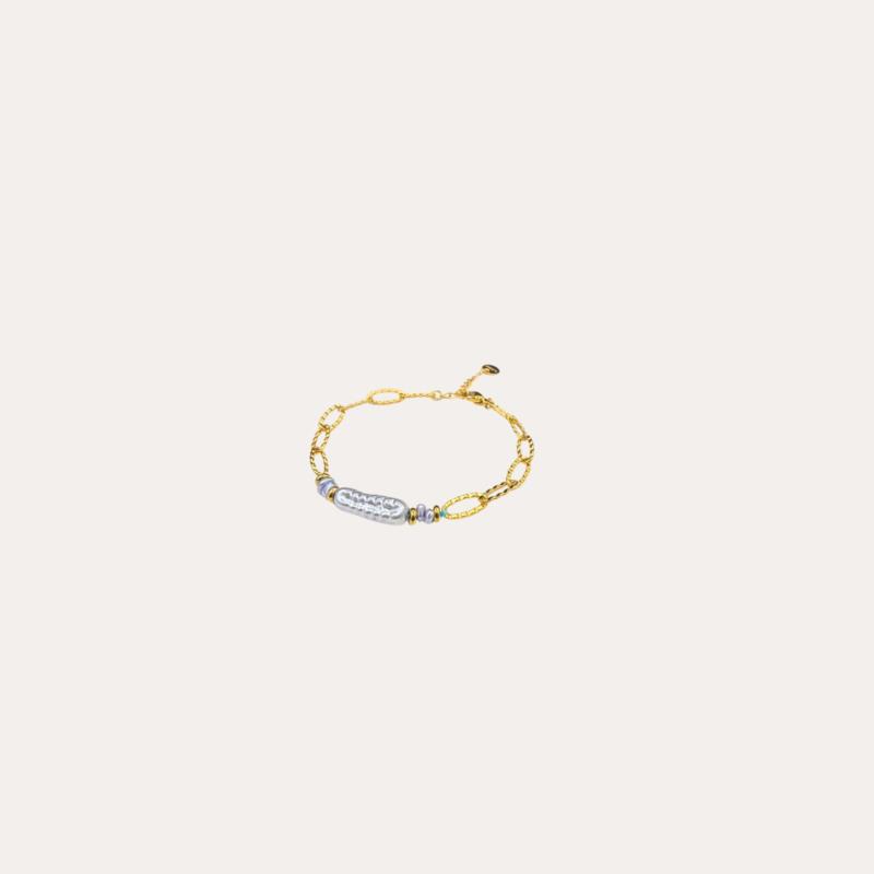 Pulsera de acero dorado con pieza perlada