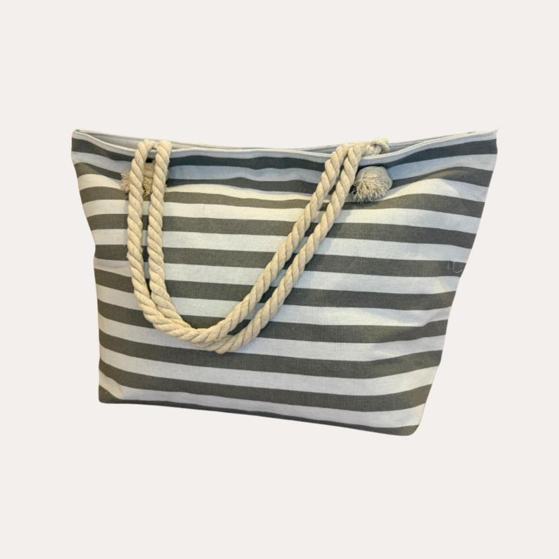 Bolso de lona con estampado de rayas marino y blancas. Incluye neceser a juego. (Gris)